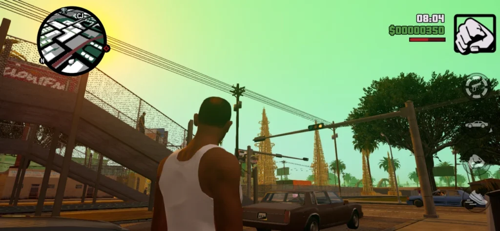 Cena de Grand Theft Auto: San Andreas Mobile, mostrando CJ caminhando pelas ruas de Los Santos ao entardecer.